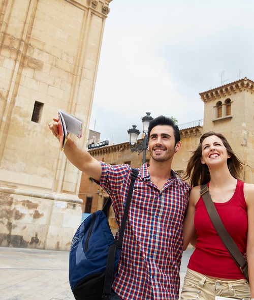 Tourist couple in old city square